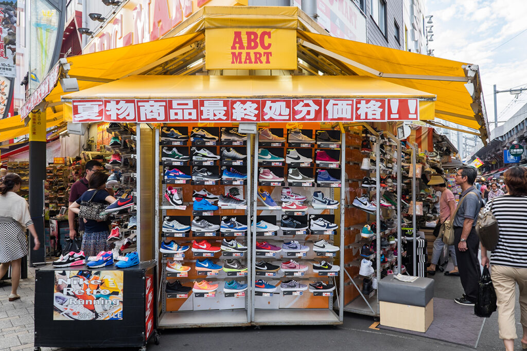TOKYO, JAPAN - CIRCA August, 2014:  Nike branded sneakers on display in Ueno street. Ueno street is a shopping center in Tokyo lined with brand names.