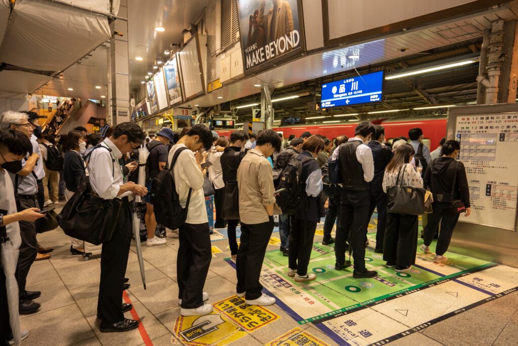 passengers lining up at Tokyo train station